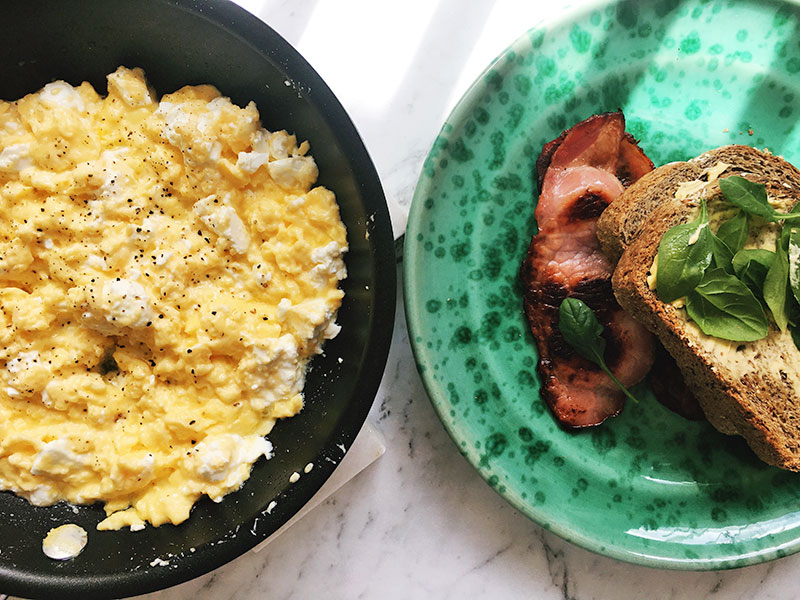 Scrambled feta cheese eggs with bacon